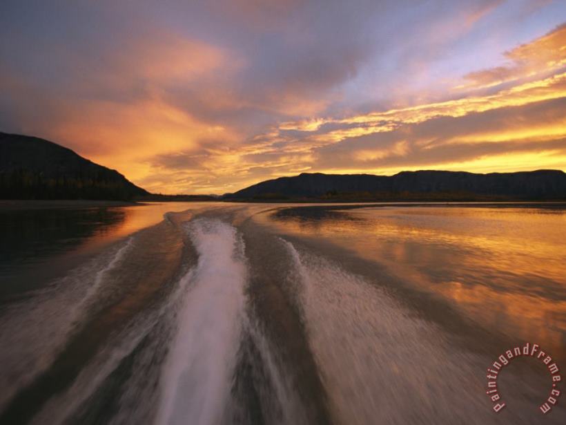 Raymond Gehman A Jet Boat Leaves a Wake in The Mackenzie River at Sunset Art Print