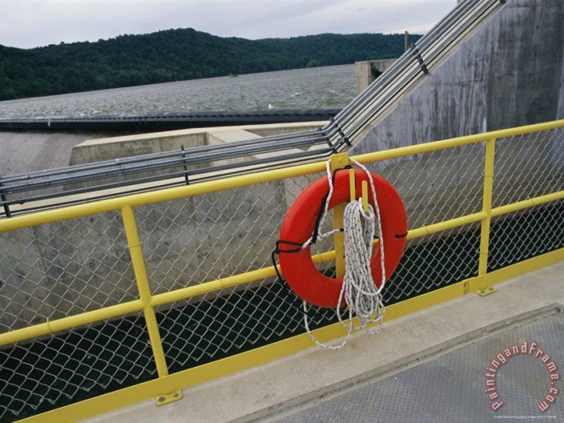 A Life Preserver Hangs on a Fence at The Holtwood Hydroelectric Dam painting - Raymond Gehman A Life Preserver Hangs on a Fence at The Holtwood Hydroelectric Dam Art Print