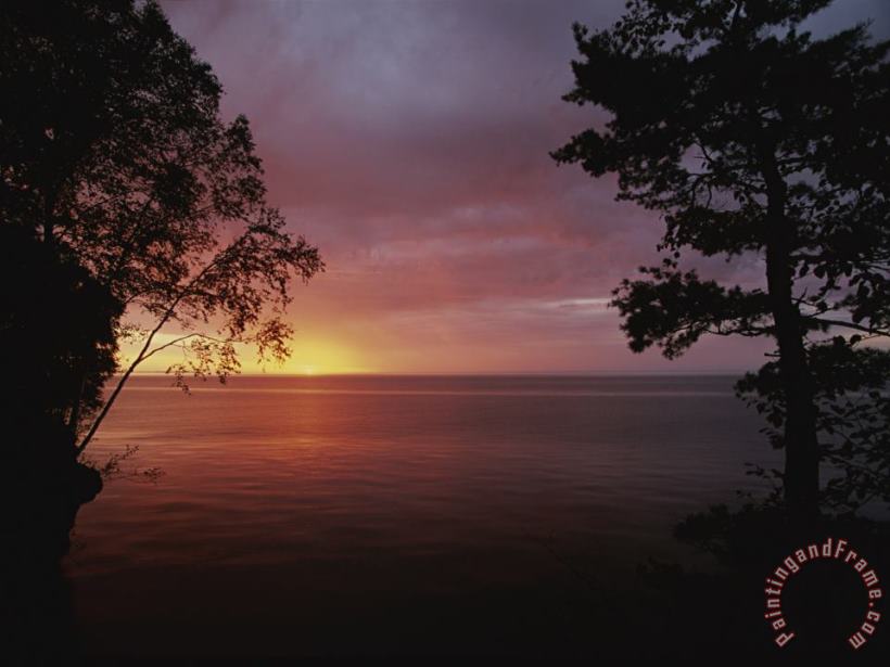 A Sunset Over Lake Superior in The Apostle Islands painting - Raymond Gehman A Sunset Over Lake Superior in The Apostle Islands Art Print