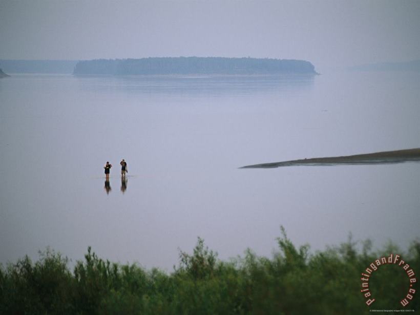 Mist Rises From The Mackenzie River As Two People Go Wading painting - Raymond Gehman Mist Rises From The Mackenzie River As Two People Go Wading Art Print