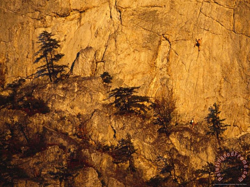 Rock Climbers on Seneca Rocks at Sunset painting - Raymond Gehman Rock Climbers on Seneca Rocks at Sunset Art Print