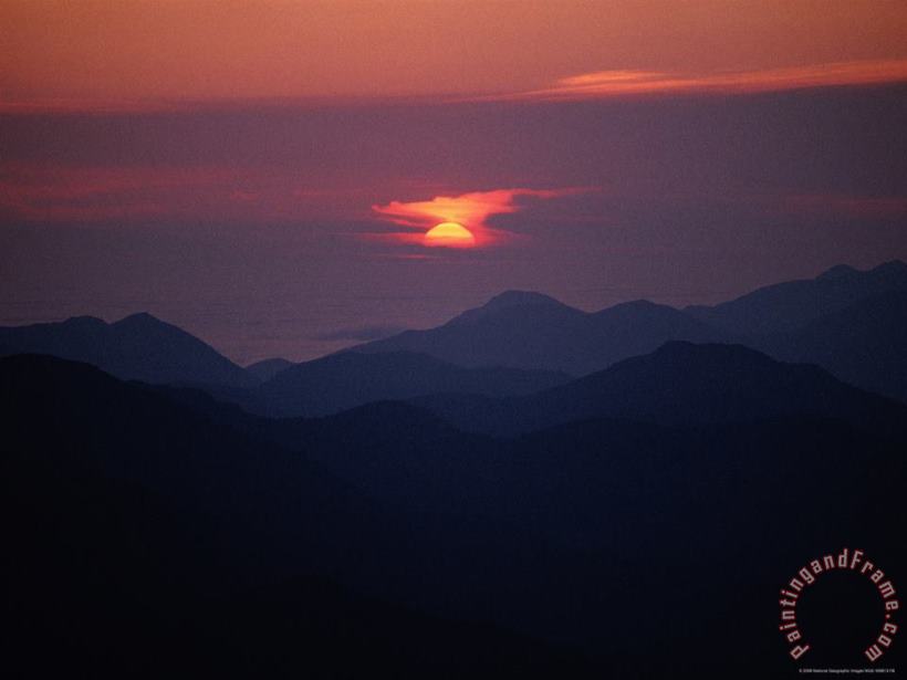 Sunrise Over a Silhouetted Range of Mountains painting - Raymond Gehman Sunrise Over a Silhouetted Range of Mountains Art Print