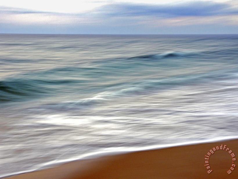 Raymond Gehman Teal And White Surf Flows on a Rust Colored Beach Under Blue Clouds Art Print
