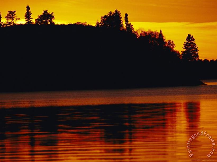 Raymond Gehman The Setting Sun Casts an Orange Glow Over Manitoba S White Lake Art Painting