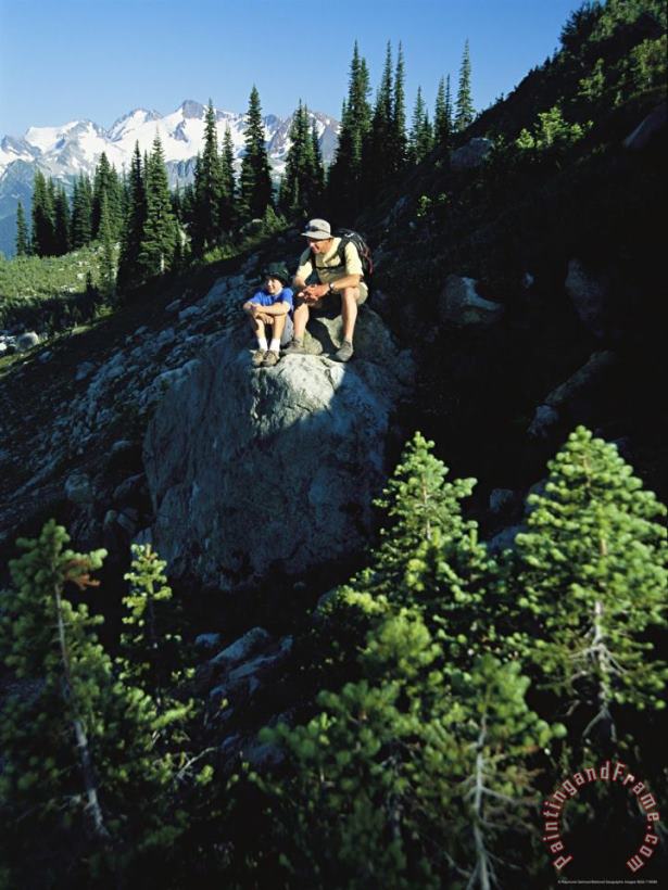 Raymond Gehman Two Hikers Rest on a Rock Amid Evergreen Trees Art Painting