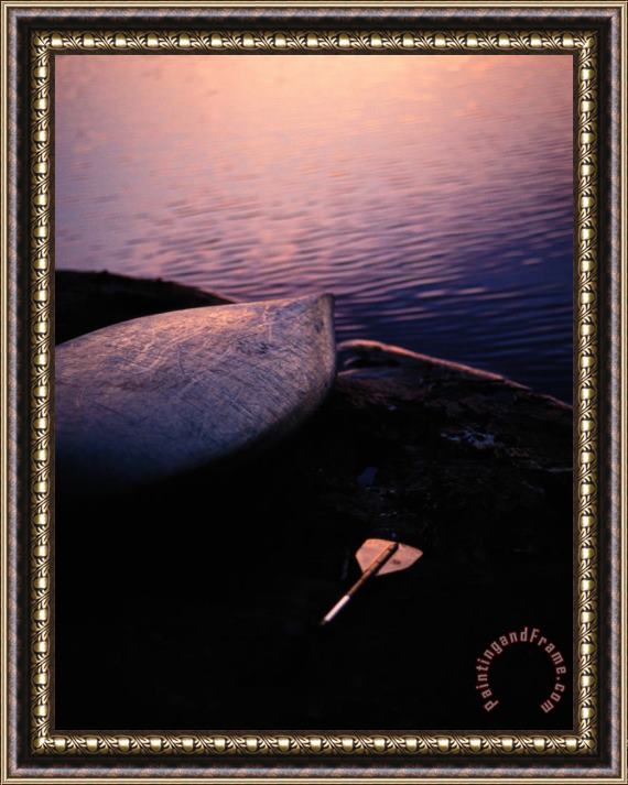Raymond Gehman Overturned Kayak And Paddle Seen at Twilight Framed Painting