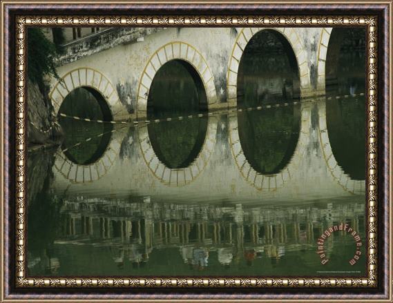 Raymond Gehman Reflections of a Gracefully Arched Bridge in Calm Water Framed Painting