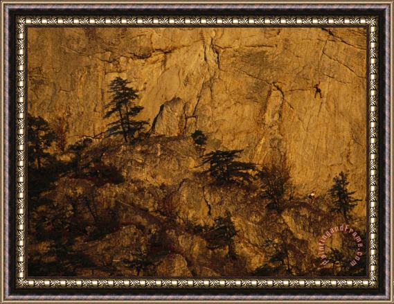 Raymond Gehman Rock Outcrop with Sheer Cliffs And Silhouetted Evergreen Trees Framed Painting