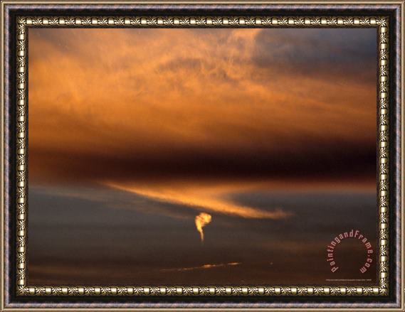 Raymond Gehman Strange Comma Like Cloud Formation at Sunset Framed Painting