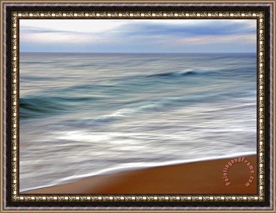 Raymond Gehman Teal And White Surf Flows on a Rust Colored Beach Under Blue Clouds Framed Painting