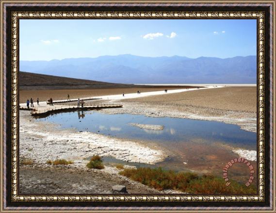 Raymond Gehman Tourists Walking on Badwater Basin in Death Valley National Park Ca Framed Print