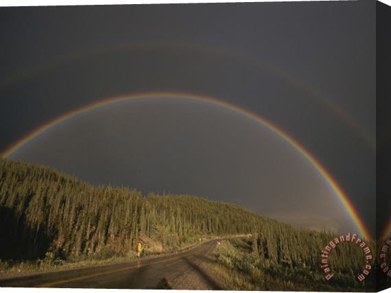 Raymond Gehman A Rainbow Arches Over The Alaska Highway in British Columbia Canada Stretched Canvas Painting / Canvas Art