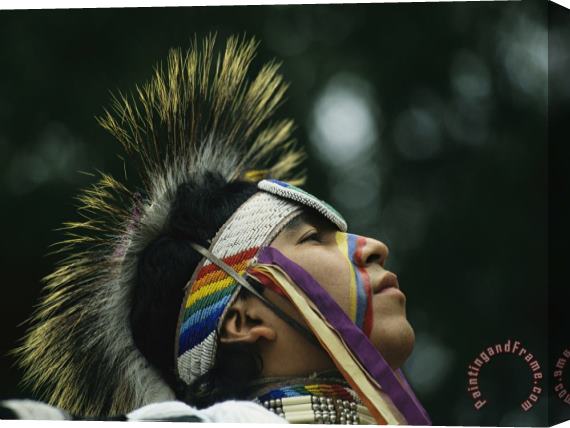 Raymond Gehman A Stoney Indian Brave Wears Ceremonial Headgear During a Festival Stretched Canvas Painting / Canvas Art