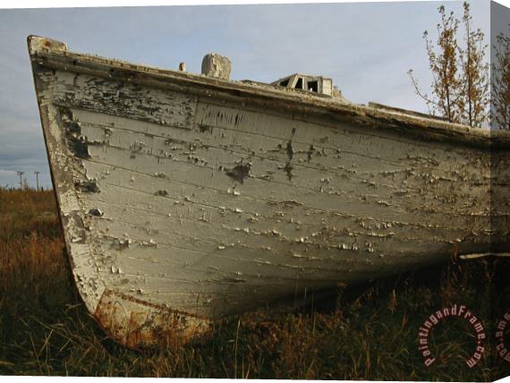 Raymond Gehman A Wooden Boat Lies Abandoned at The Hay River Shipyard Stretched Canvas Painting / Canvas Art