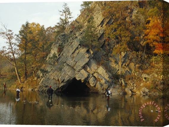 Raymond Gehman Four Men Trying Their Luck Fishing Near a Limestone Cave Entrance Stretched Canvas Painting / Canvas Art