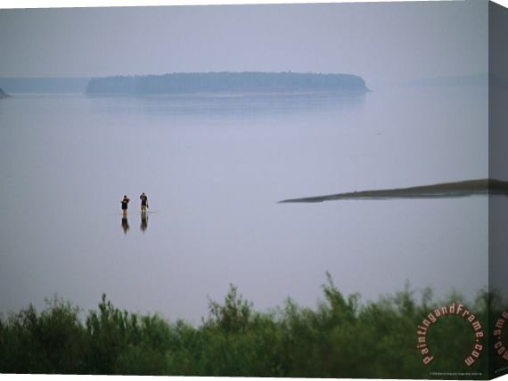 Raymond Gehman Mist Rises From The Mackenzie River As Two People Go Wading Stretched Canvas Painting / Canvas Art