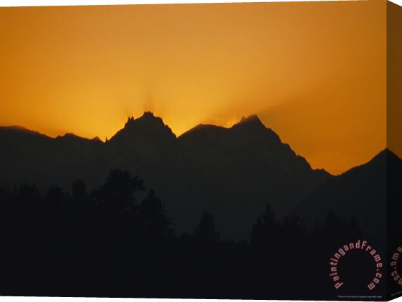 Raymond Gehman Mountain Peaks Appear in Silhouette at Twilight Stretched Canvas Print / Canvas Art