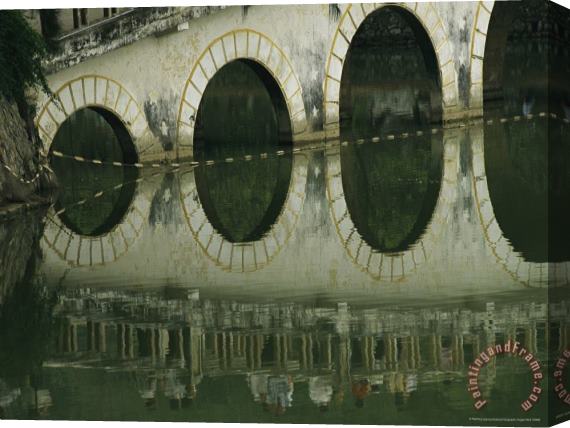 Raymond Gehman Reflections of a Gracefully Arched Bridge in Calm Water Stretched Canvas Print / Canvas Art