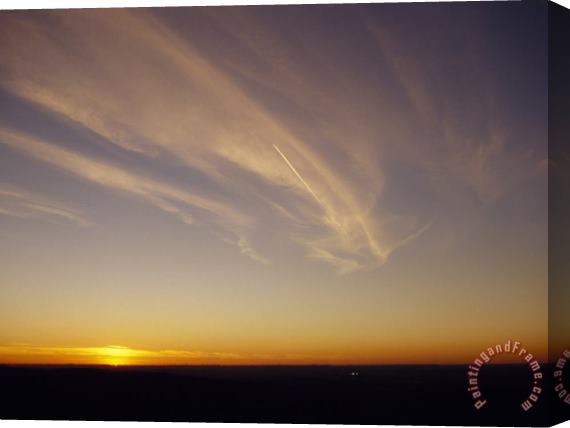 Raymond Gehman Wispy Clouds And Jet Vapor Trail in The Sky at Sunset Stretched Canvas Print / Canvas Art